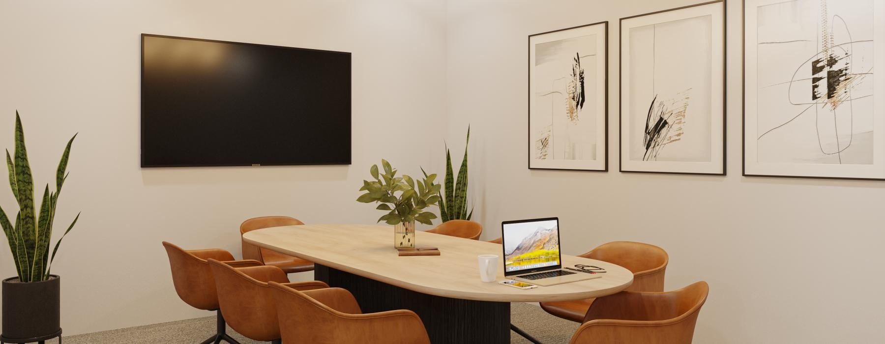 a table with chairs and a laptop