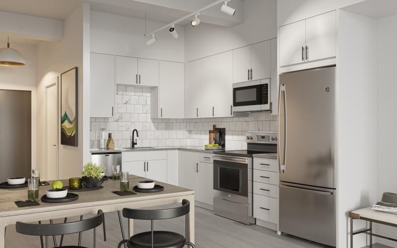 a kitchen with white cabinets